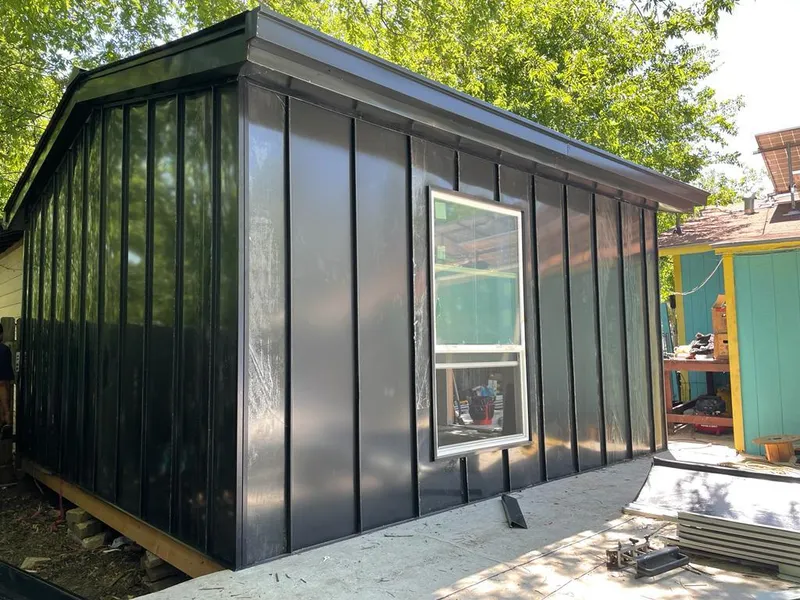 Black standing seam metal wall panels for Roof Inspection in Lindale