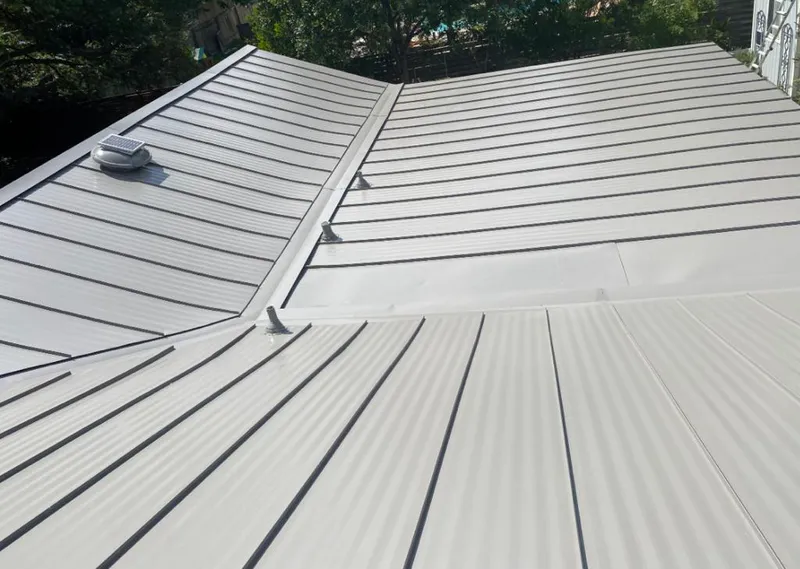 Solar attic fan installed on a metal roof for Roof Ventilation in Lindale