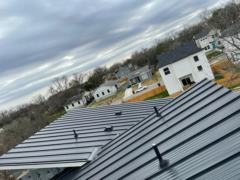 Standing seam metal roof panels with vents for Skylight Repair in Lindale